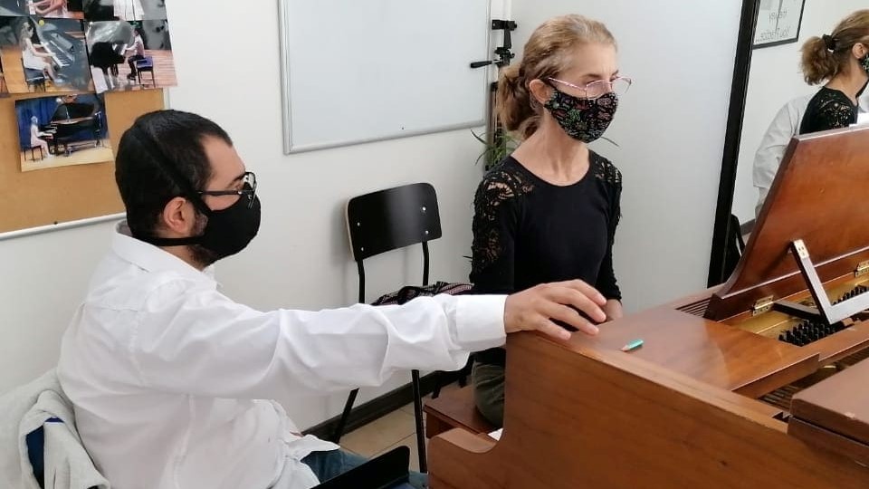Mrs. Claudia during her lessons with Prof. Víctor